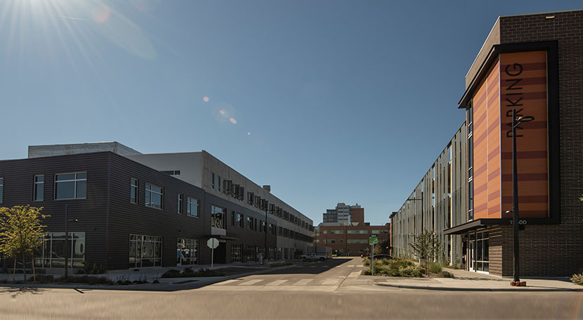 Morning sun over Bioscience 3 and the adjacent Fitzsimons Innovation Community Parking Garage and CU Anschutz Medical Campus facilities