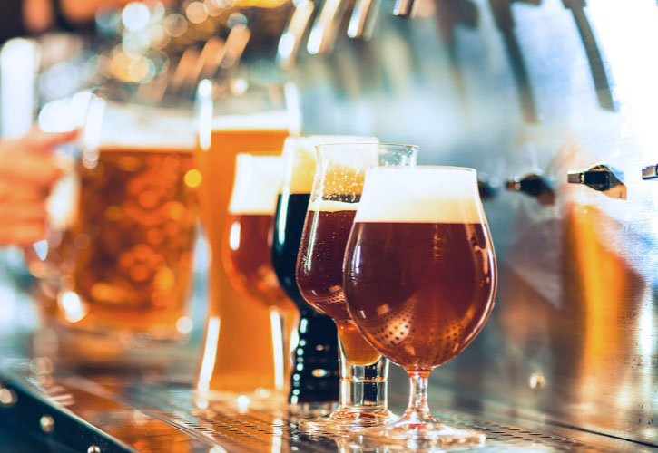 multiple types of beer in various sized glasses